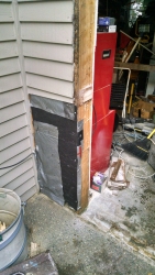This picture shows proper house-wrap over the plywood replacement. Note: The plywood was half-inch repurposed from the ReStore.